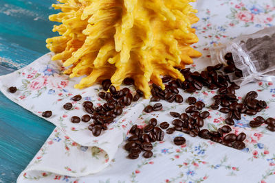 Roasted coffee beans on tablecloth