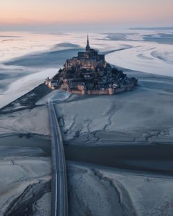 Aerial view of monastery against sky during sunset