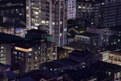 High angle view of illuminated buildings in city