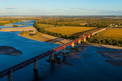 High angle view of river amidst landscape against sky