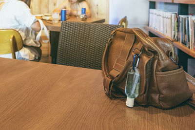 Close-up of purse on table