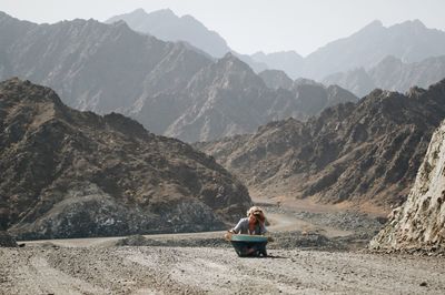 People sitting on mountains