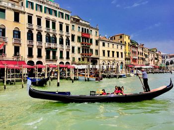 People on boats in canal