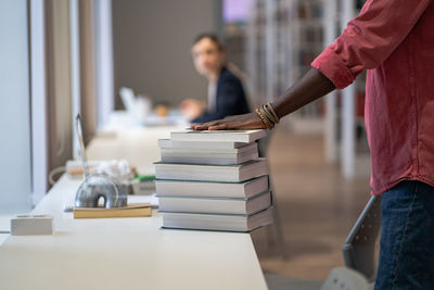 Midsection of man working in office