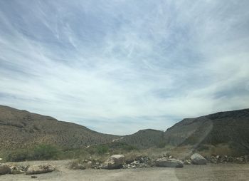 Scenic view of landscape and mountains against sky