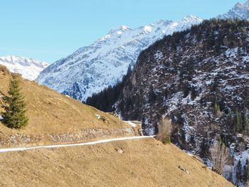 Scenic view of snowcapped mountains against sky