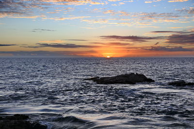 Scenic view of sea against sky during sunset