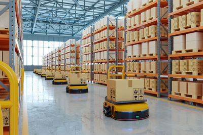 Agv automated guided vehicle in warehouse logistic and transport.3d rendering