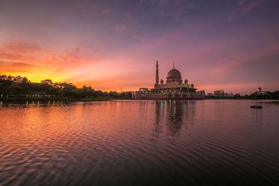 Reflection of clouds in water at sunset