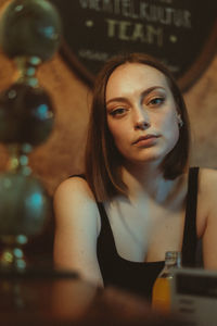 Portrait of young woman at cafe