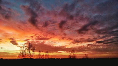 Scenic view of dramatic sky during sunset