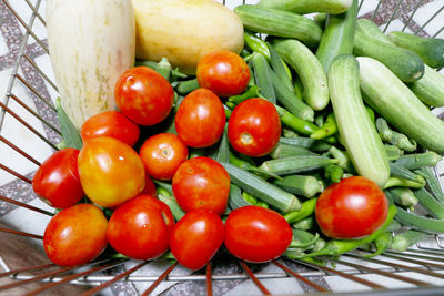 High angle view of tomatoes in basket on table