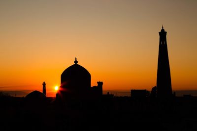 Silhouette mosque against sky during sunset