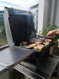 High angle view of meat on barbecue grill