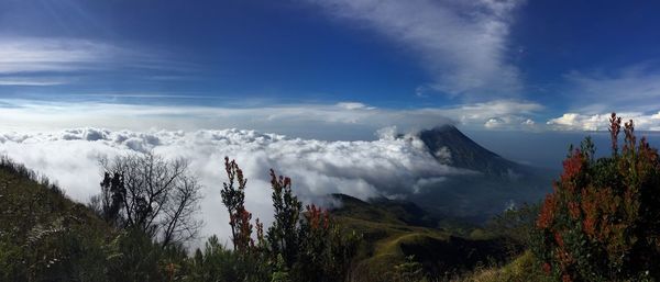 Scenic view of mountains against cloudy sky