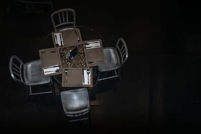 Close-up of telephone booth on table against black background