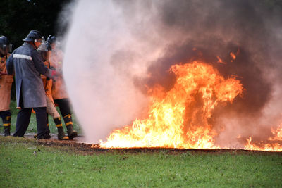 Panoramic view of fire at night