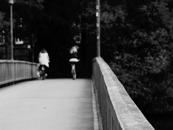 People walking on railing