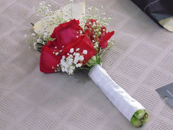 High angle view of red rose on table