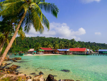 Scenic view of swimming pool by sea against sky