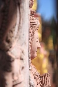 Close-up of statue against temple