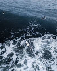 High angle view of man surfing in sea