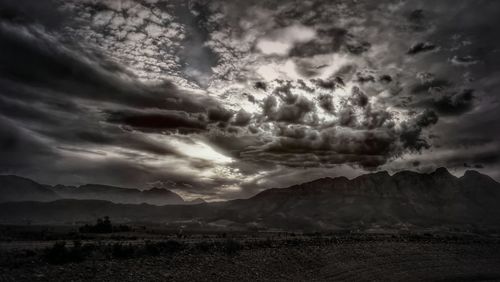 Scenic view of dramatic sky over landscape