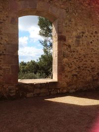 View of arched wall through window