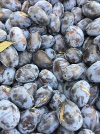 Full frame shot of plums for sale in market