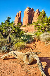 Rock formations on landscape against sky