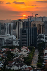 High angle view of buildings against sky during sunset