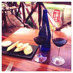 Close-up of wine glasses on table