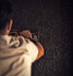 Person with arms raised in background