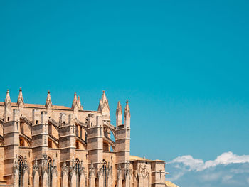 Low angle view of building against blue sky