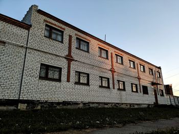 Low angle view of old building against clear sky