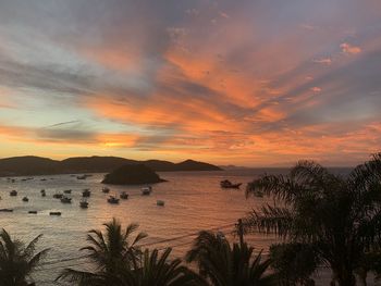 Scenic view of sea against orange sky