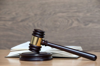 Close-up of gavel on table