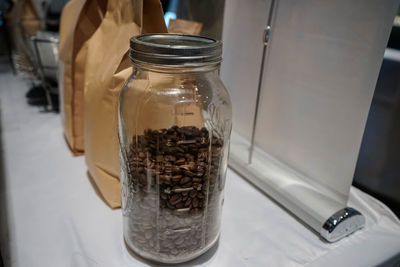 Close-up of glass of jar on table