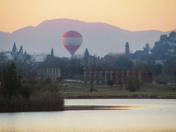 Hot air balloon flying over landscape