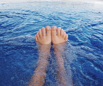 Low section of person in swimming pool