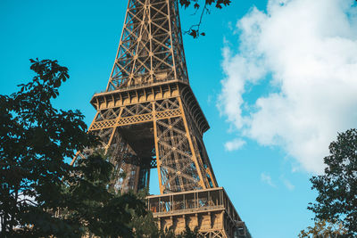 Low angle view of tower against cloudy sky