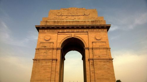 Low angle view of india gate against sky