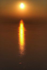 Scenic view of sea against romantic sky at sunset