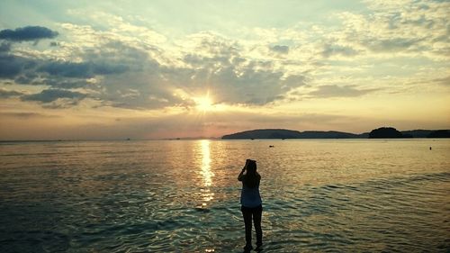 Scenic view of sea at sunset