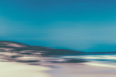 Scenic view of sea against blue sky