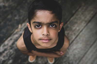 High angle portrait of boy standing outdoors