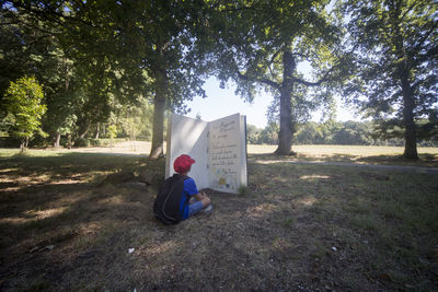 Man sitting on chair at park