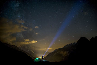 Scenic view of mountain against sky at night