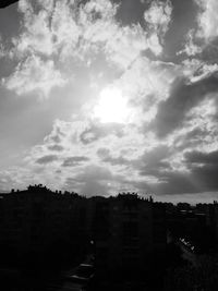 View of residential district against cloudy sky