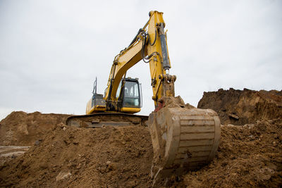 Excavator during earthmoving at construction site. backhoe digging the ground for the foundation